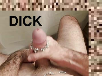 Jerking big dick while wearing chains