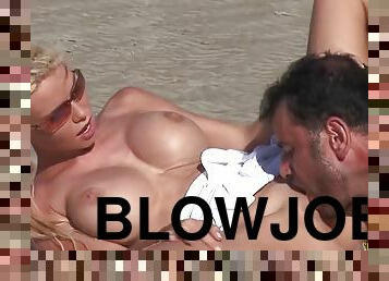 Passionate fuck on the beach with a stunning blonde with big tits