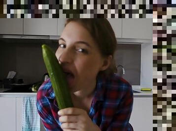 Gorgeous Julia has fun with long green cucumber