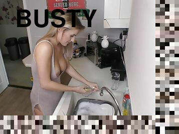 Beautiful busty blonde washing the dishes with downblouse