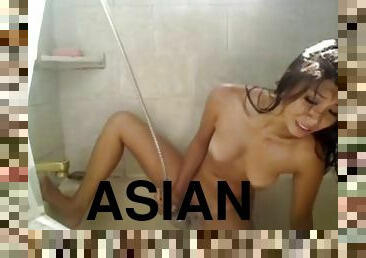 Cute asian girl wishing for an orgasm in the bathtub