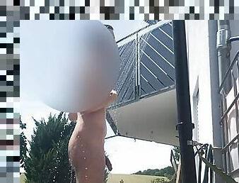 hairy tall twink showering outside with his semi hard cock