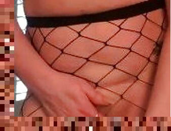Milf in fishnets rubs her pretty pussy just for you
