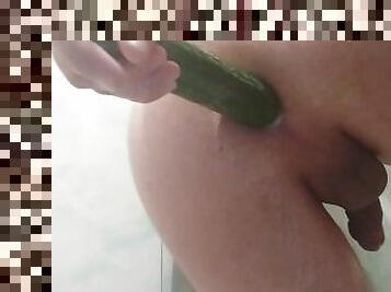 A young guy fucks his ass hard with a cucumber - anal masturbation in the bathroom