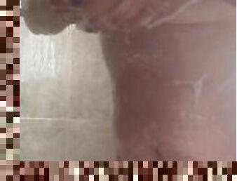Chubby milf playing with her tits in the shower
