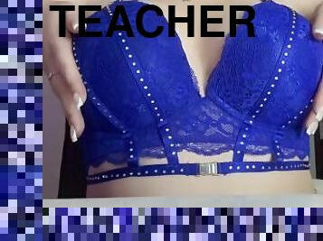 The teacher's squeezing her breasts