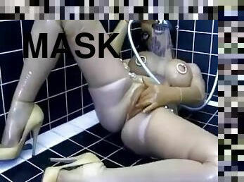 Hot girl full encased in transparent latex outfit enjoys rubber shower in her bathroom