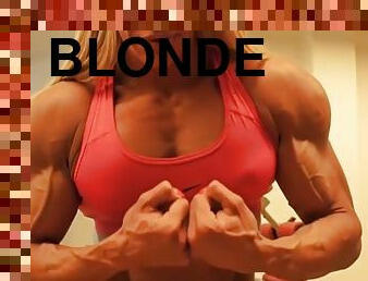 Sexy blonde female bodybuilder is shredded and veiny