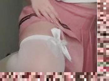 Pretty girl in stockings and mini skirt.