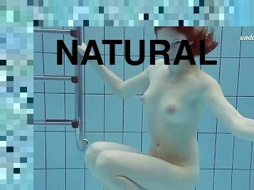 Pink swimswear babe Lera showing naked body underwater