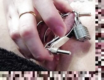 Metal fetish slut clamps her pussy with new toy from fan!!! *genital piercings*