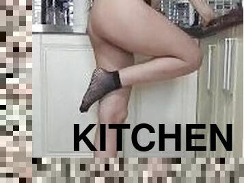 Sexy horny girl gets horny while cooking in the kitchen