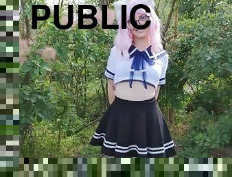 Sexy schoolgirl with ears in uniform walks down the abandoned road