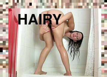 Hairy Vanessa J takes a shower and plays with her thick pussy