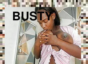 Busty Ebony sucks her big chocolate nipples on cam