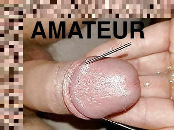 Amateur thin needle in cock and cum closeup