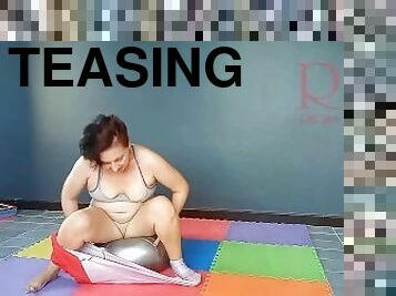 Regina Noir. A woman in yoga leotards practices yoga in the gym. Transparent red leotard yoga. 2