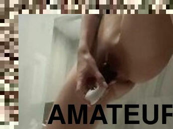 Very nice girl playing toys in the shower