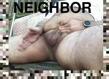 fat guy with a small cock jerks his soft dick while watching his neighbor outside