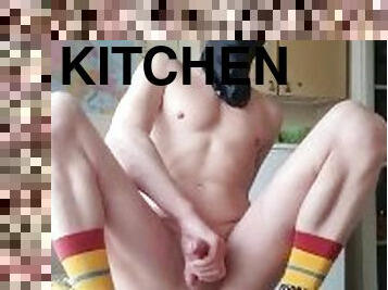 guy on the kitchen table working with  dildo