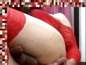 Cute crossdresser in red lingerie loves her dildo and sticks it in her ass