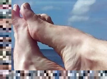 hairyartist feet flexing over water and land