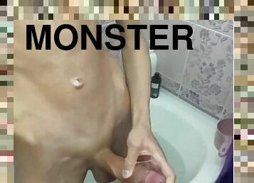 Sweet boy fingering his huge cock in the bathroom