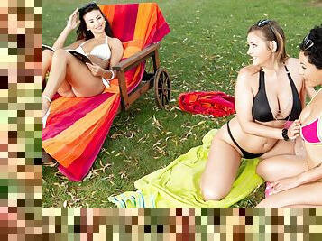 Three beautiful ladies in bikinis make love outdoors