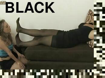 Mistress Selena in black nylon sofa