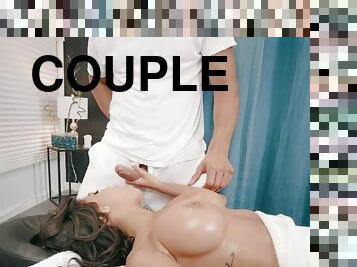 Shay Evans is oiled up & fucked by the masseur during couples massage