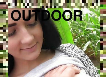 Lovely green eyed babe sucks outdoors in corn field