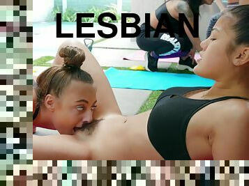 Frisky petite babes make lesbian love in the gym