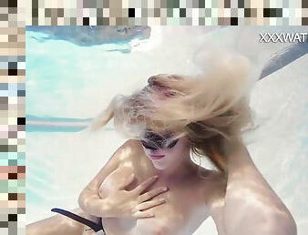 Blonde babe Sophie Murena masturbates in the pool