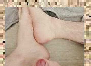 Straight man playing with his big uncut cock and cumming over his feet