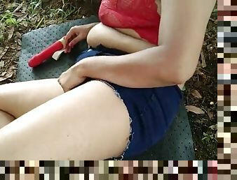 Step cousin playing outdoors with a dildo in a brief and risky public scene