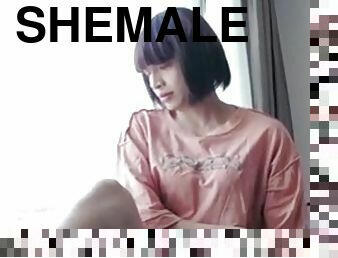 Shemale Ting Xuan masturbated near the hotel window