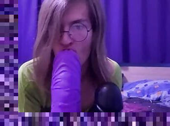Cute femboy sucking and stroking huge dildos