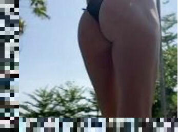 Hot fit blonde stood poolside