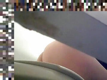 Nasty babe is pissing in the toilet