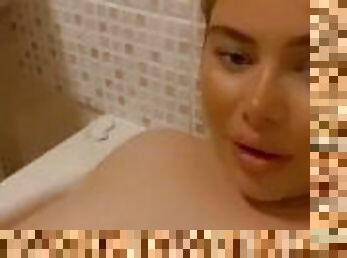 Girl playing with boobs in the bath
