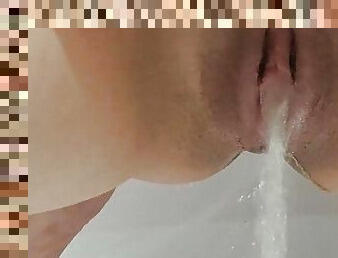 Squirting pussy in the bathtub
