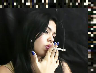 Smoking with her plump lips