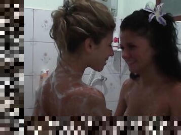 Two soapy babes are playing with their pussies