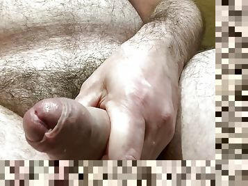 Fat daddy plays with hairy uncut cock
