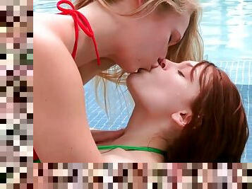Lesbian with her tongue caressing gentle pussy of beauty in pool