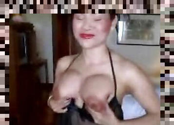 Asian whore in lingerie sucks his cock