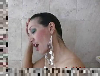 Busty brunette in shower