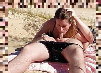 Nudist couple enjoying blowjob at the public beach