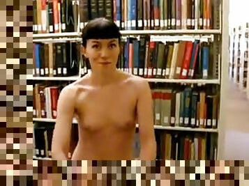 Lady strips off and walks around library