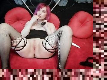 Sexy goth girl with pink hair fucks pussy with black dildo